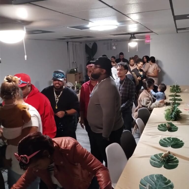 Grown-up party guests laughing during games