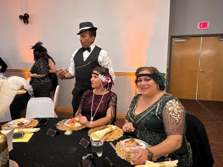 Adults celebrating at a Gatsby theme party