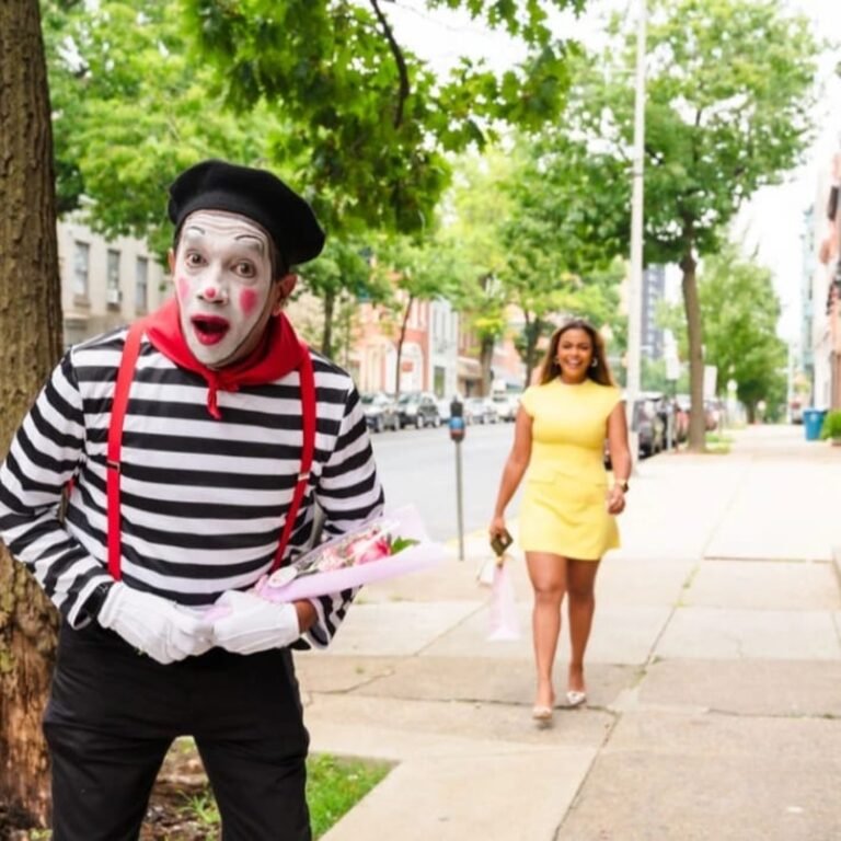Professional mime welcoming a guest at an event